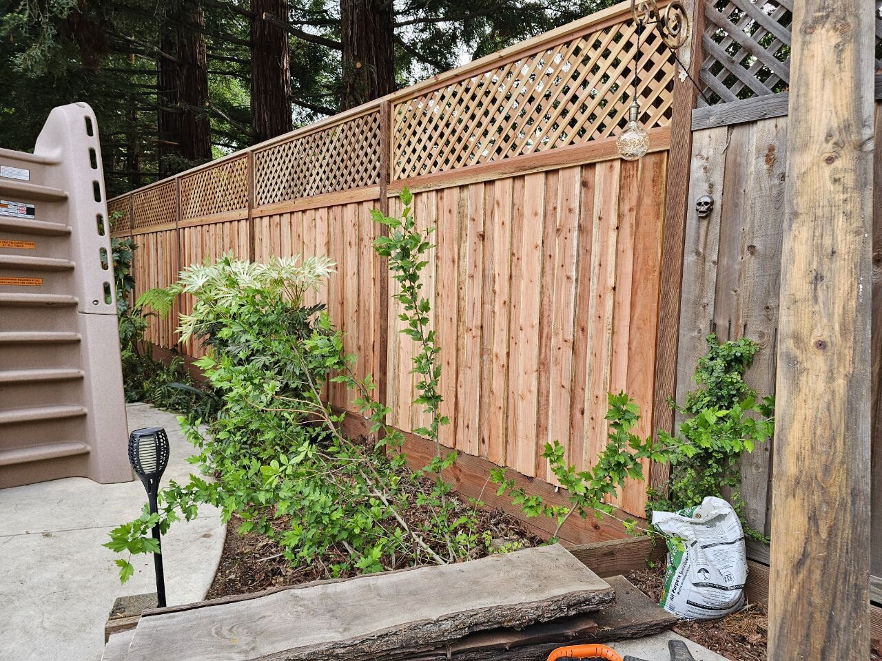 Privacy fence with lattice top and garden
